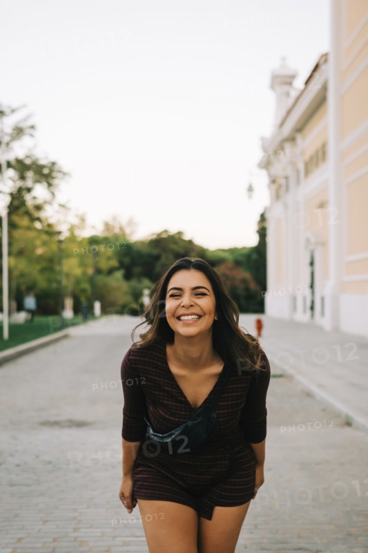 Smiling woman on footpath