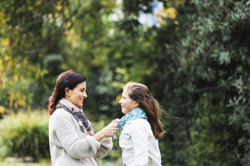 Mother adjusting daughter's scar