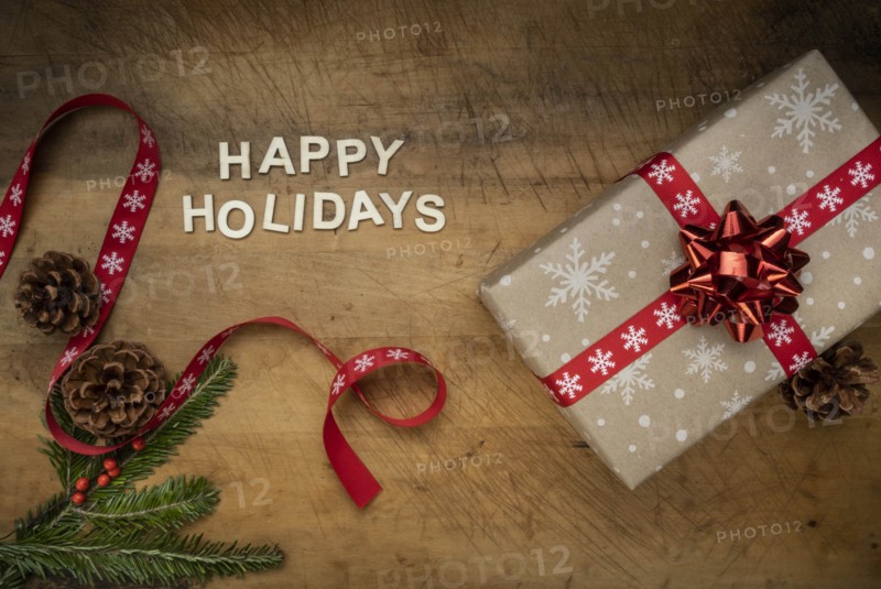 Words 'Happy holidays' by Christmas present