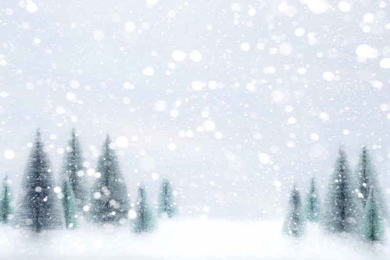 Snow falling on Christmas tree ornaments