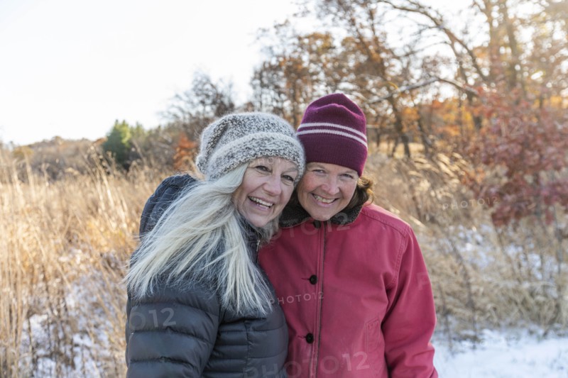 Smiling women wearing winter clothing
