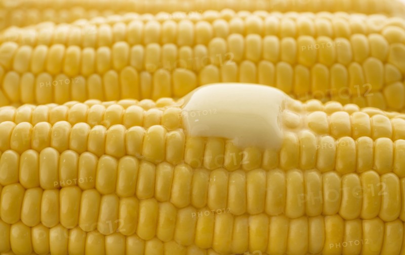 Close up of butter melting on corn cob