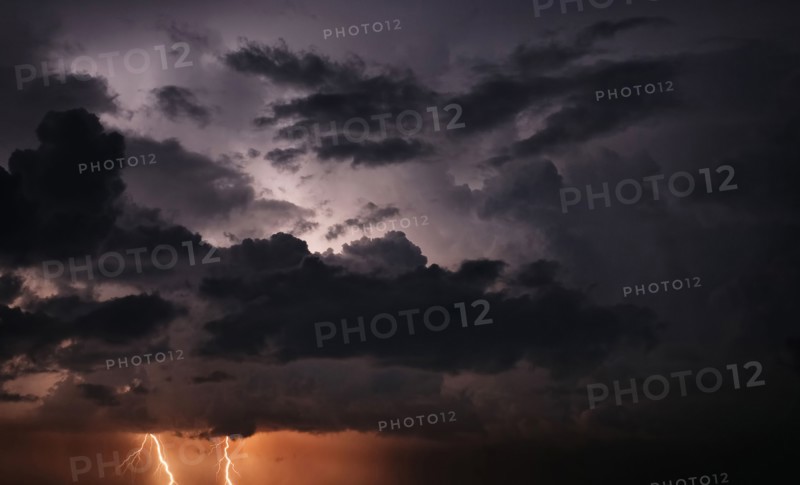 Lightning and storm clouds in sky