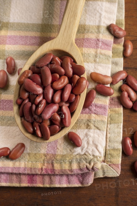 Kidney beans on wooden spoon