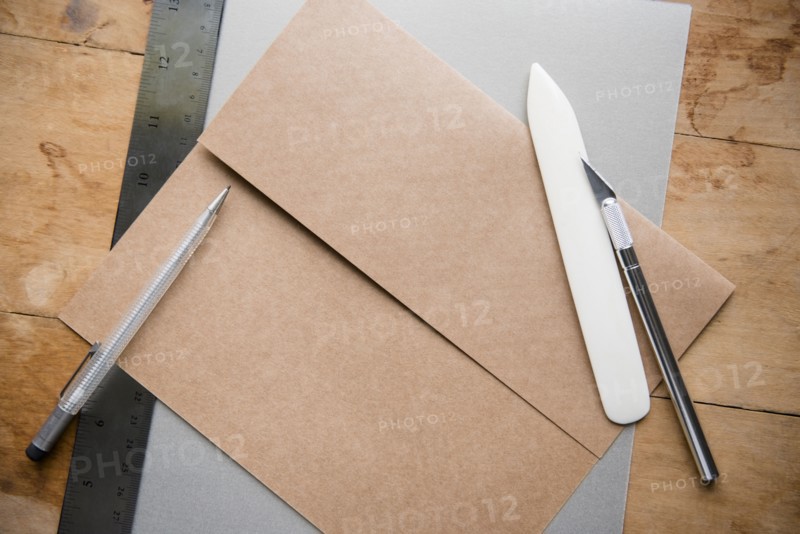 Envelope with knife and paper scorer