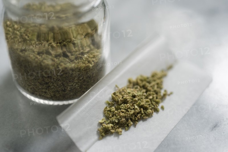Marijuana in rolling paper and glass jar