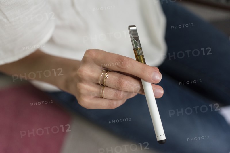 Hand of woman holding electronic cigarette