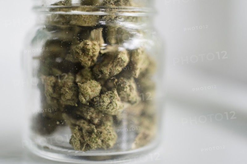 Glass jar filled with marijuana