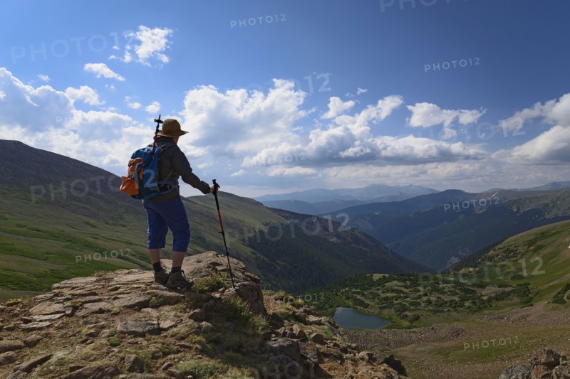 Woman admiring view while hiking on Berthoud Pass Trail in Colorado