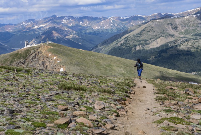 Woman hiking trail on Berthoud Pass Trail in Colorado