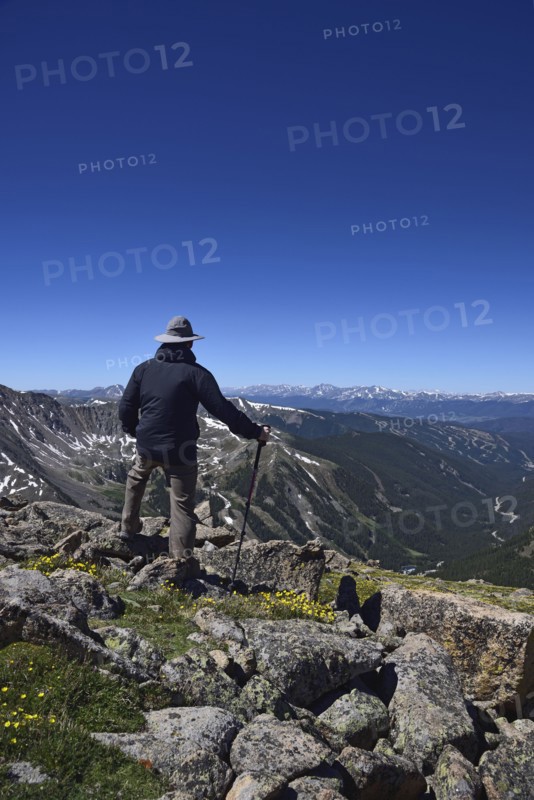Hiker looking at view of mountains at Loveland Pass in Colorado