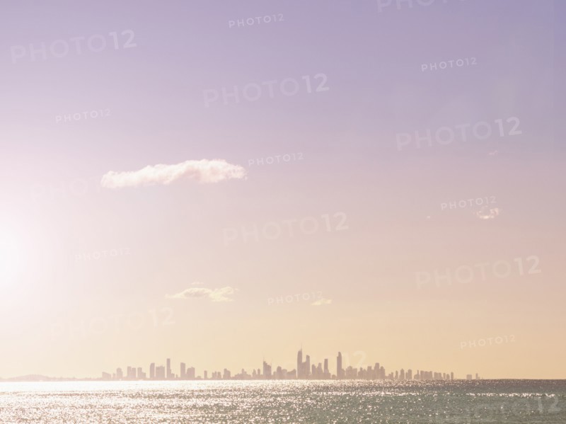 Cityscape and sea at sunset
