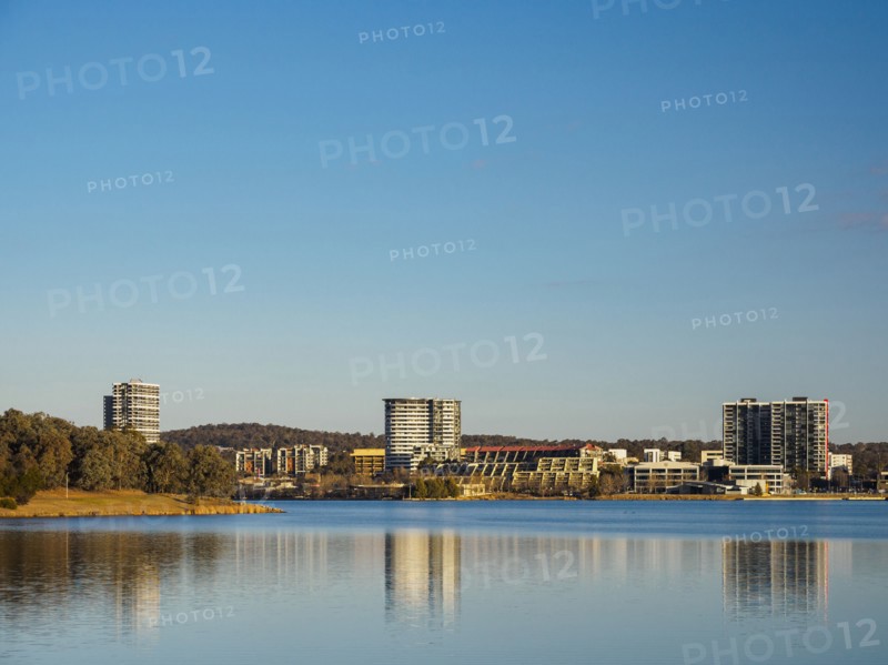 Buildings by lake in Ginninderra, Australia