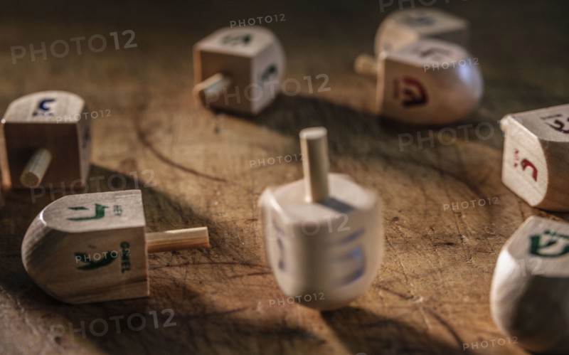 Dreidels on wooden table