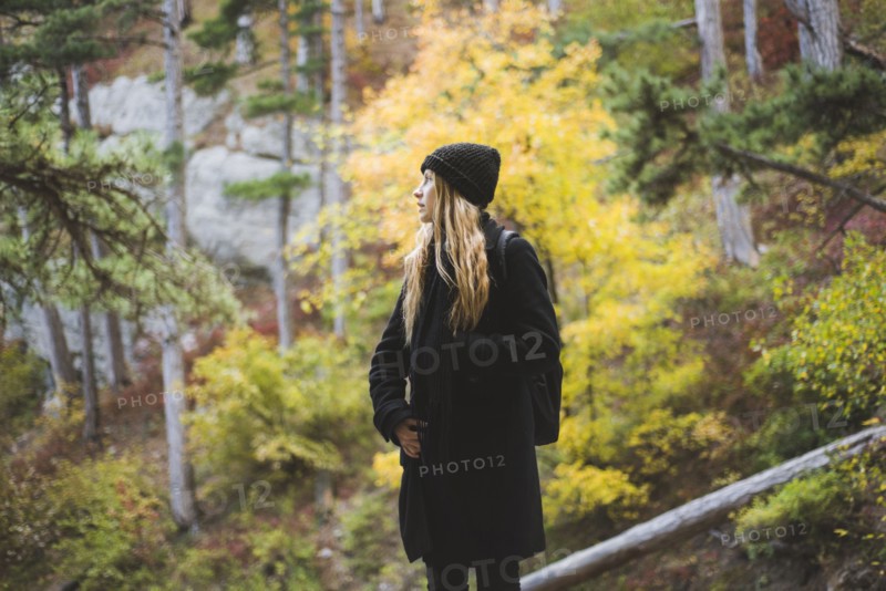 young woman in autumn forest