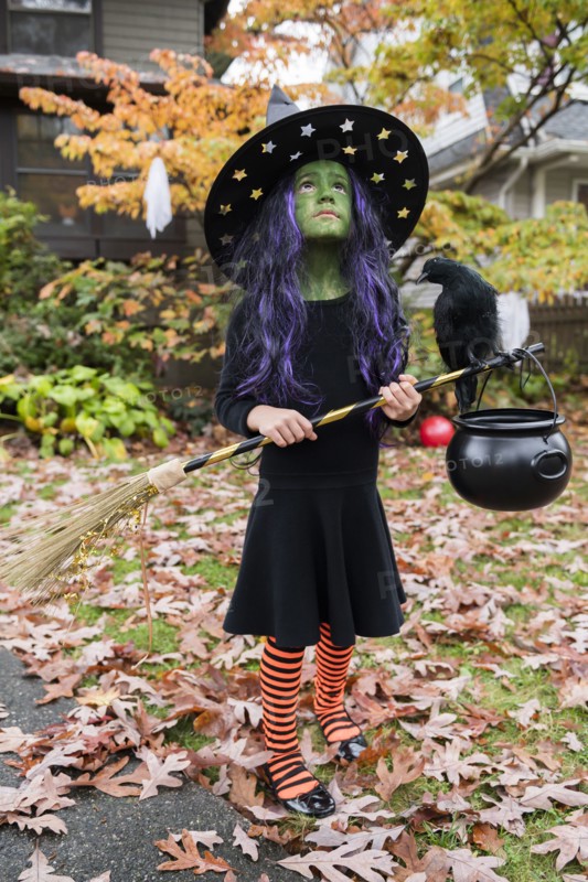 Girl in witch costume for Halloween