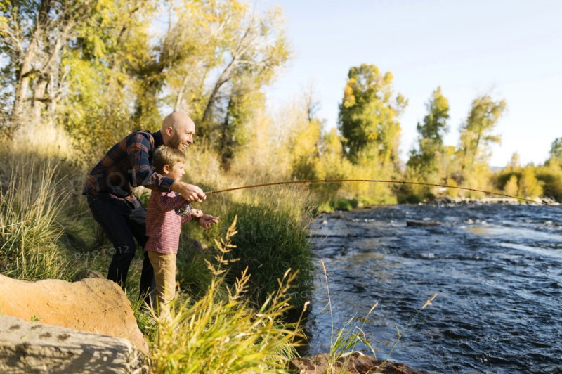 Father and son fishing together