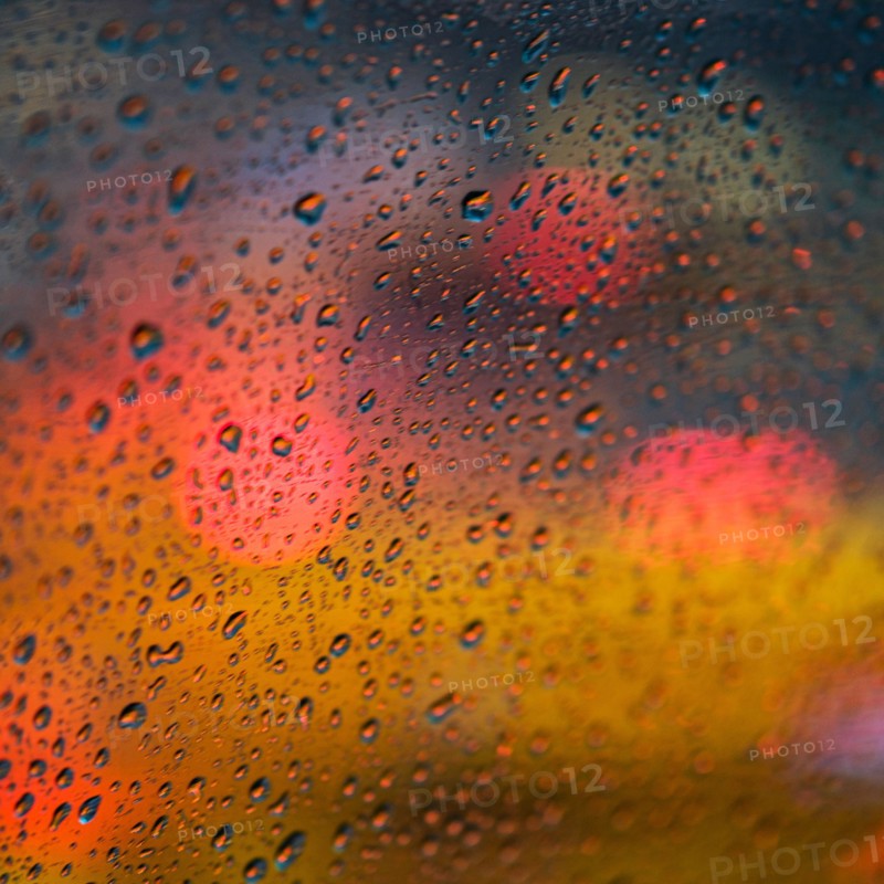Defocussed light behind wet window