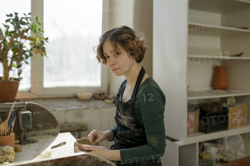 Potter in workshop