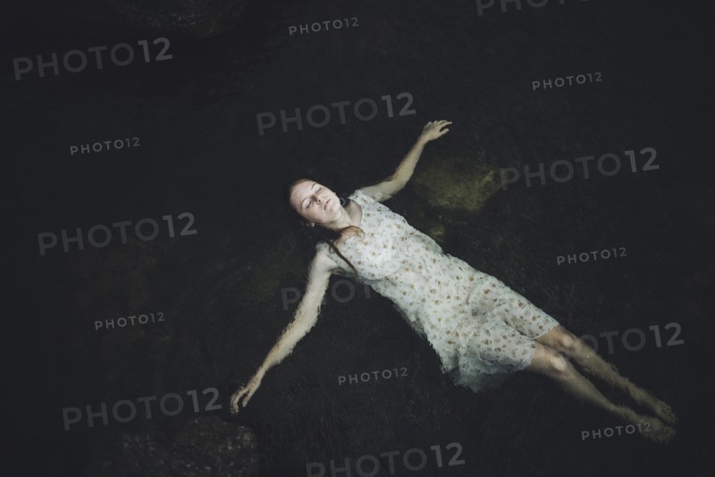 young woman floating in water