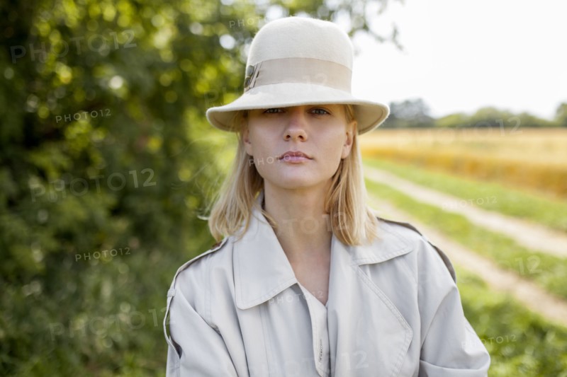 young woman with fedora