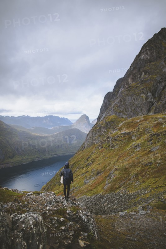 young man hiking on mountain in Norway