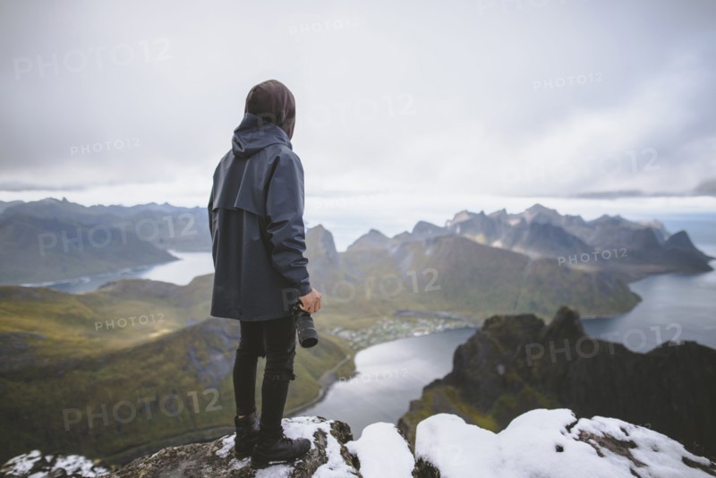 young man hiking on mountain in Norway