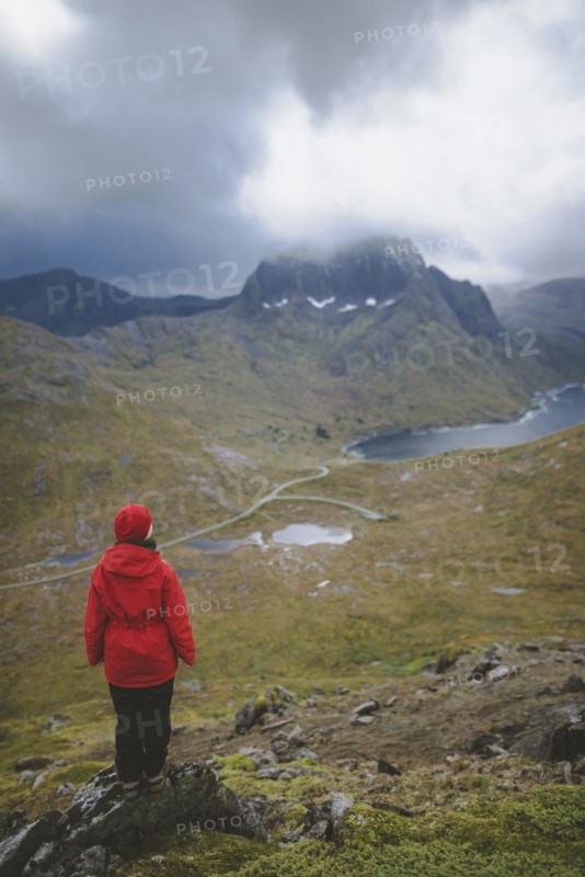 Woman in red jacket on mountain