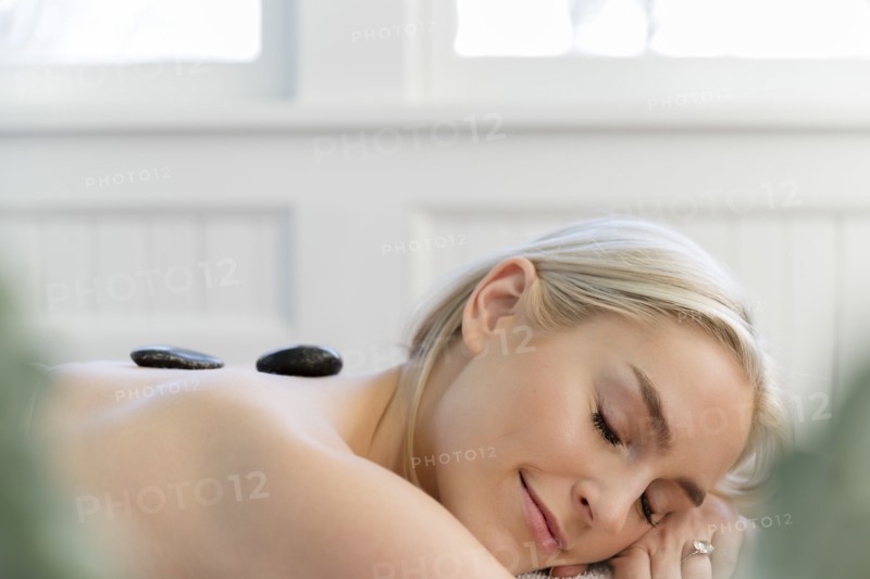 Woman enjoying hot stone massage