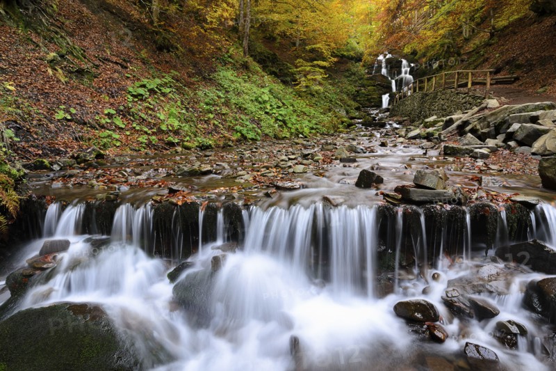 Ukraine, Zakarpattia region, Carpathians, Verkhniy Shypot waterfall, Blurred waterfall in autumn woods