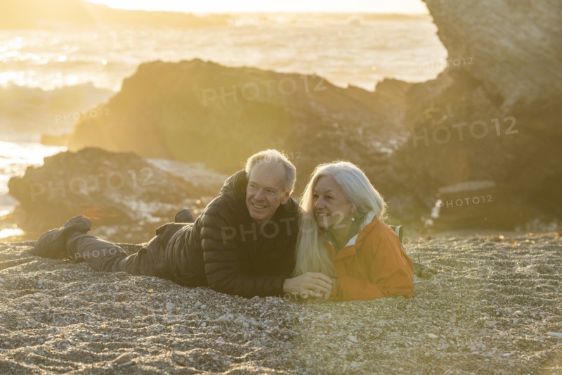 Senior couple enjoying sunset on beach