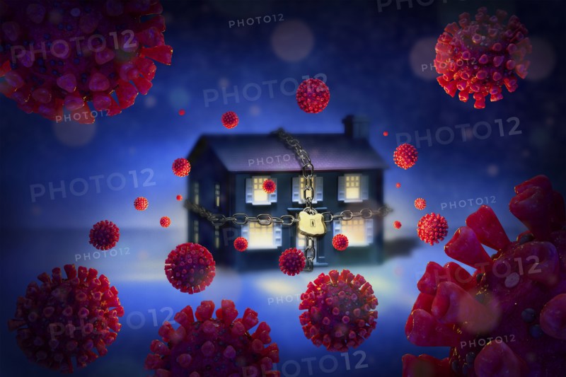 Digitally generated image of chained up house surrounded with Coronaviruses