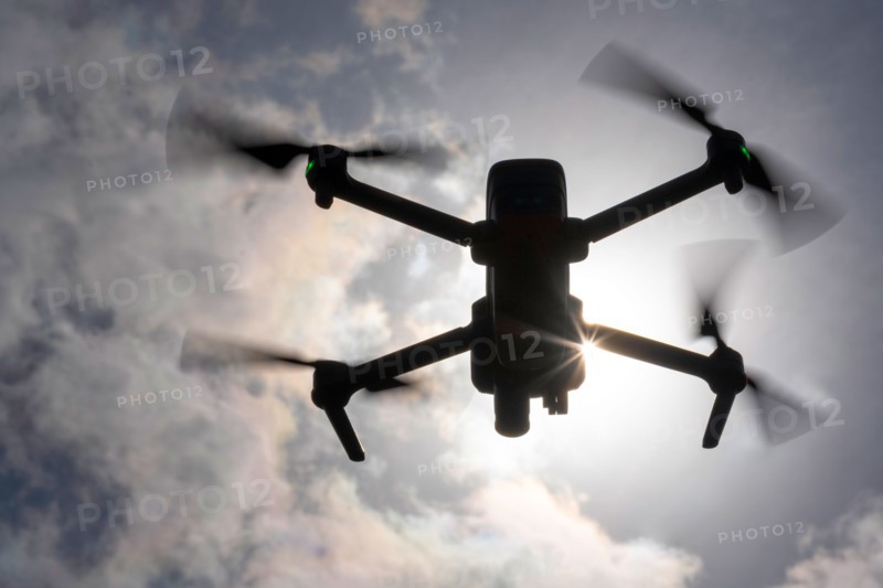 Drone flying in sky