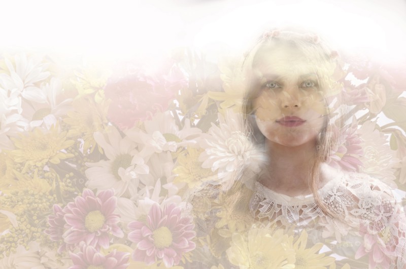 Double exposure of woman and flowers