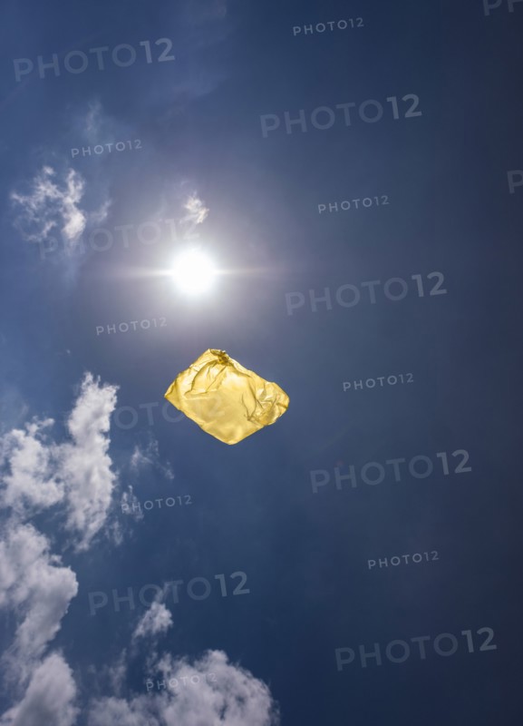 Yellow plastic bag in sky