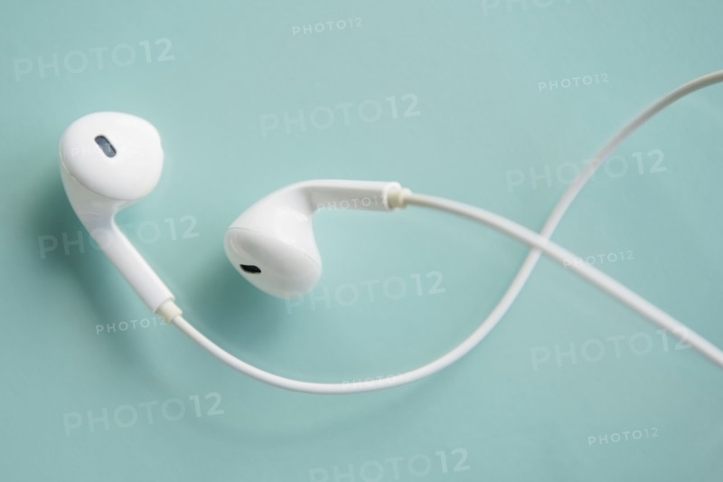 Earphones on blue background