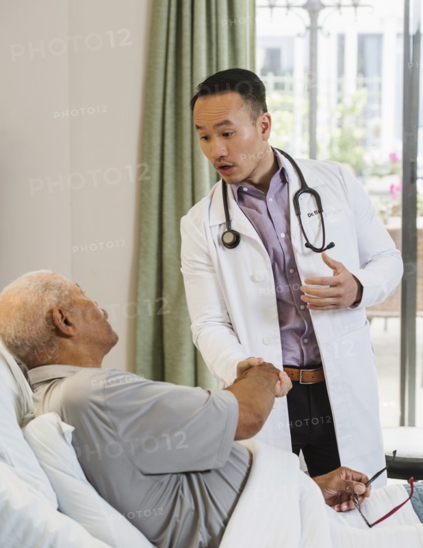Senior man and doctor shaking hands
