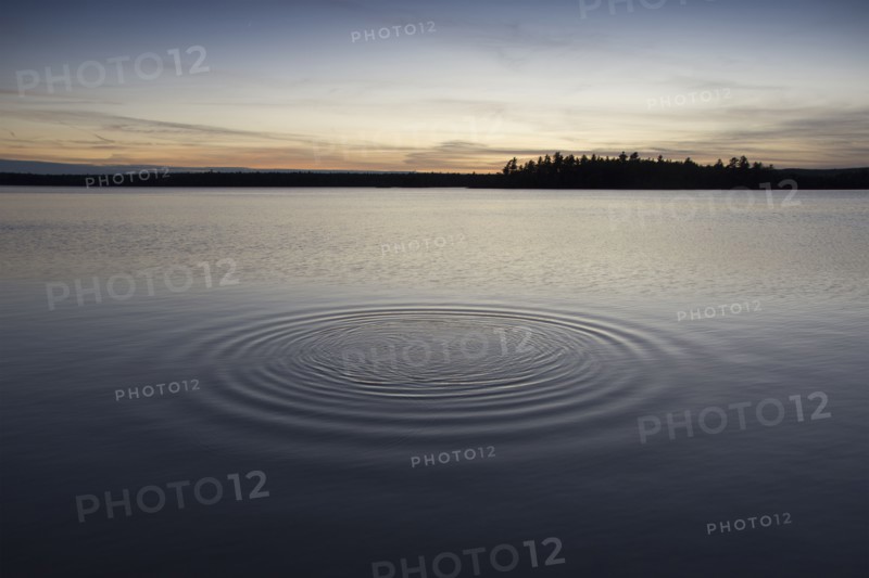 Ripples in lake at sunset