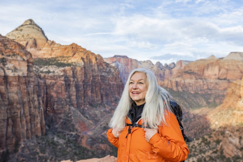 Smiling woman by canyon at Zion National Park in Utah, USA