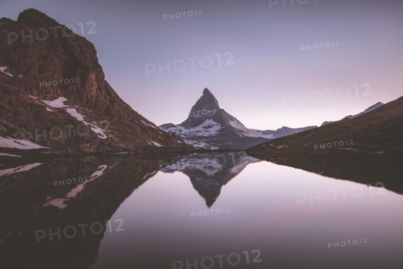 Matterhorn mountain and lake at sunrise in Valais, Switzerland