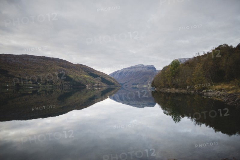 Fjord under overcast sky in Odda, Norway