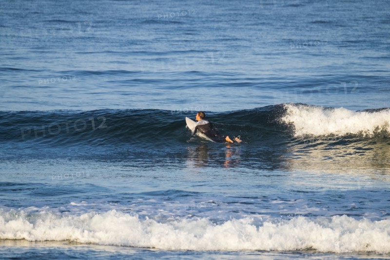Teenage boy surfing