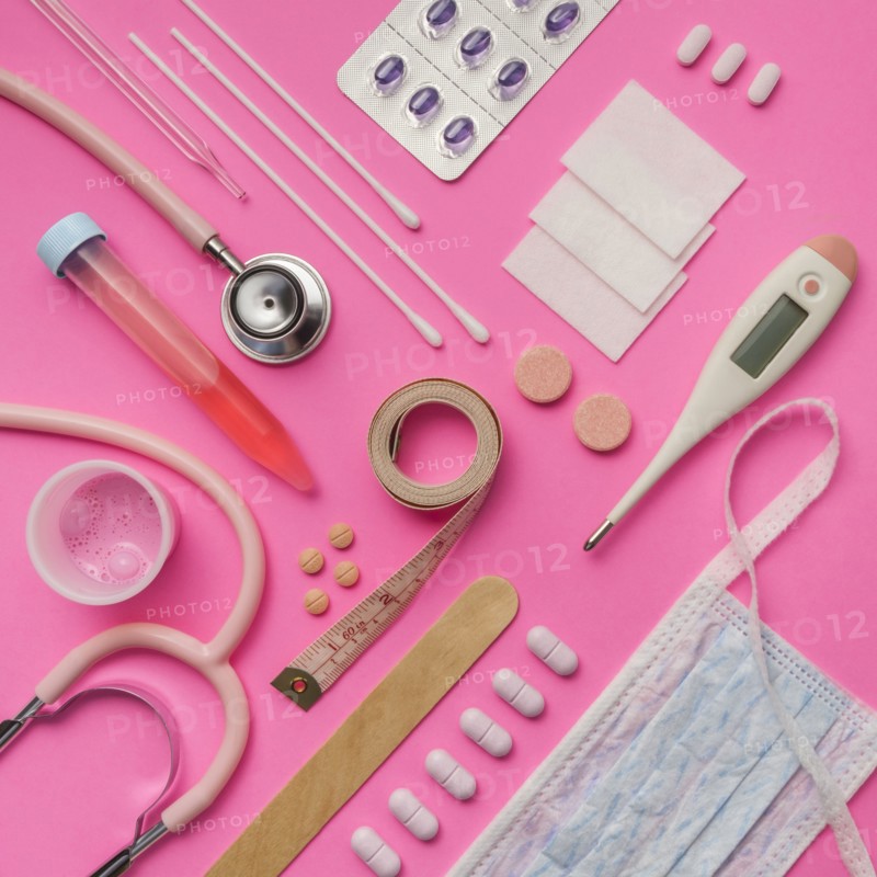 Medical supplies on pink background