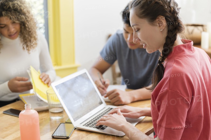 Coworkers working together in office