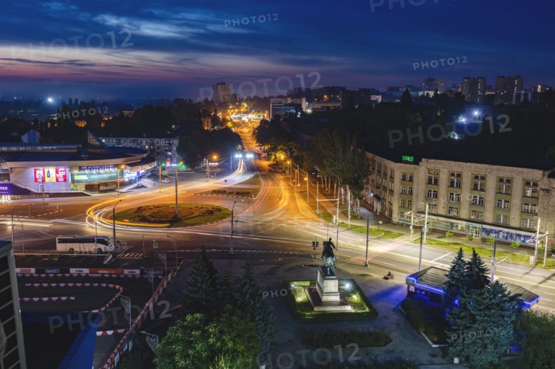 Moldova, Chisinau, Cityscape illuminated at dusk