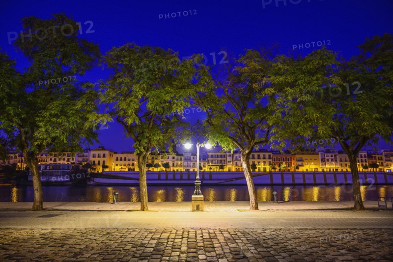 Spain, Andalusia, Seville, Guadalquivir River at night