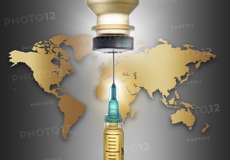 Covid-19 vaccine with world map in background
