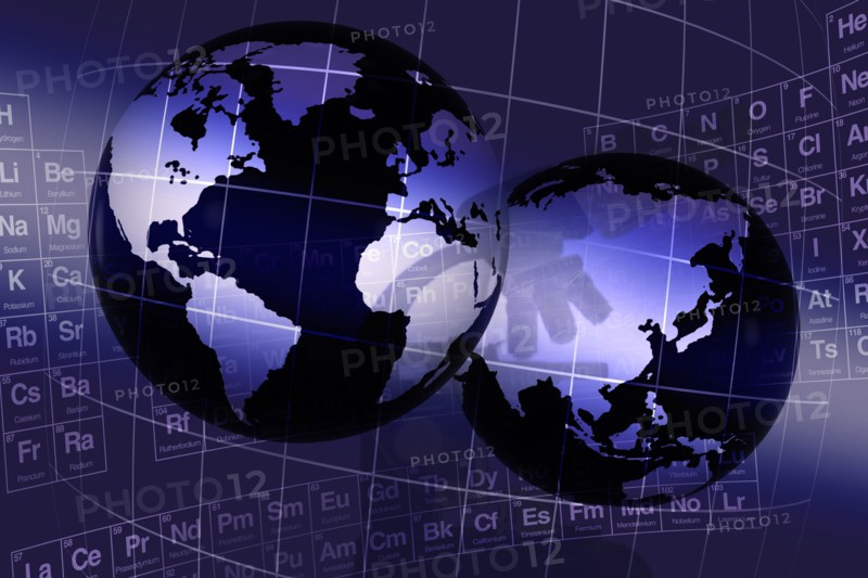 Digitally generated image of globes and periodic table
