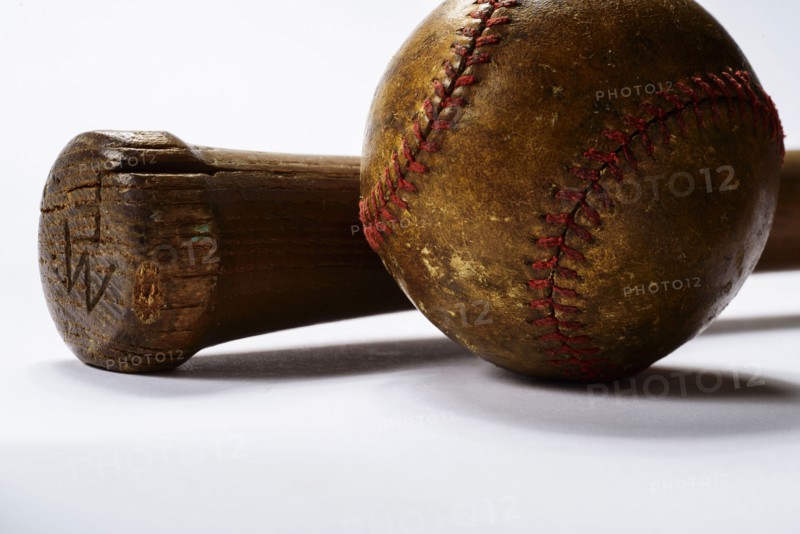 Studio shot of old baseball bat and ball