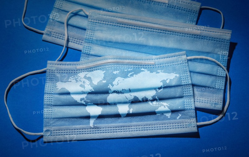 Studio shot of surgical masks with world map
